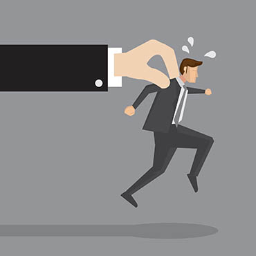 Shutterstock image (by Ho Yeow Hui): businessman tries to run but is held back by a large hand.